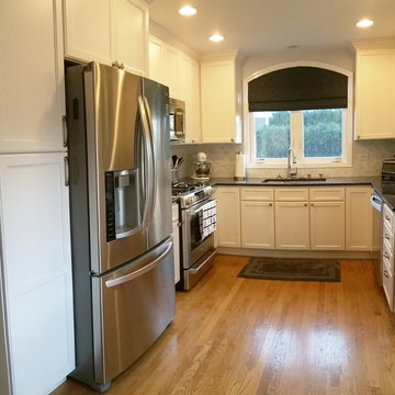 White Kitchen With Blue Pearl Granite Counters