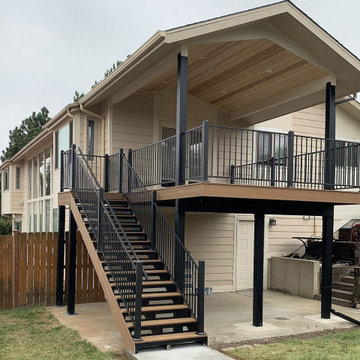 New deck with steel deck framing, steel deck railing, and a gabled deck cover