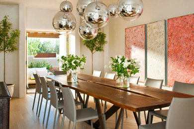 Inspiration for a southwestern medium tone wood floor kitchen/dining room combo remodel in Albuquerque with white walls