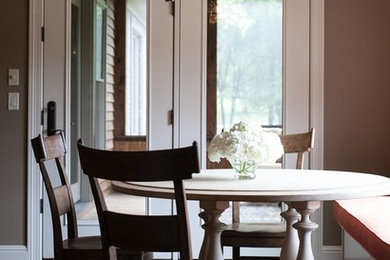 Example of a transitional dining room design in Other