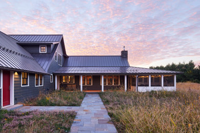 Inspiration for a two-story shingle gable roof remodel in Minneapolis with a metal roof
