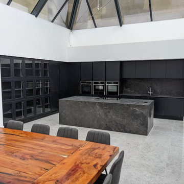 Manor House in Dorchester, Black handleless kitchen with island