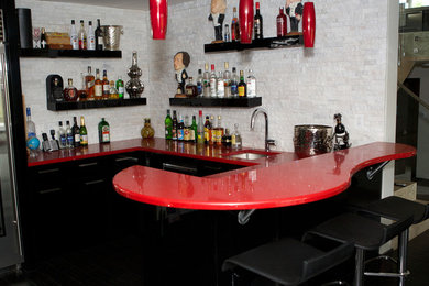 Inspiration for a mid-sized contemporary u-shaped seated home bar remodel in Edmonton with an undermount sink, flat-panel cabinets, black cabinets, quartz countertops, white backsplash and stone tile backsplash
