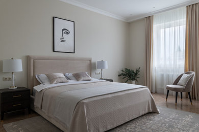 Inspiration for a mid-sized transitional master bedroom in Moscow with yellow walls, medium hardwood floors, no fireplace, beige floor and wallpaper.