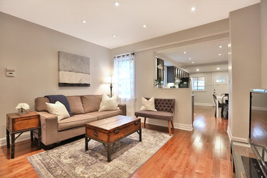 Example of a transitional family room design in Toronto