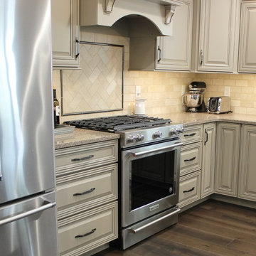 Farmhouse kitchen Taupe Painted Cabinets,Quartz Tops, and Dark Island