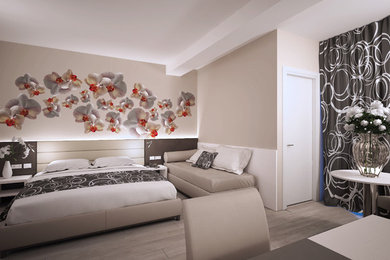 Foto di una camera da letto design con pavimento in vinile