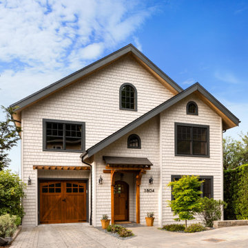 Exterior makeover with stained cedar shake siding and wood accents