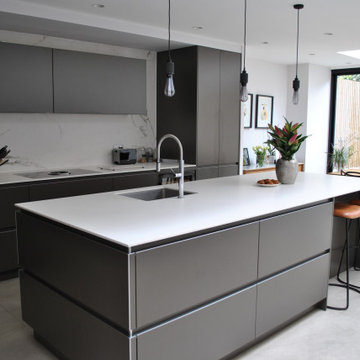 Stylish modern handleless kitchen in dark grey