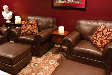 Small elegant enclosed light wood floor family room photo in Baltimore with red walls and no tv
