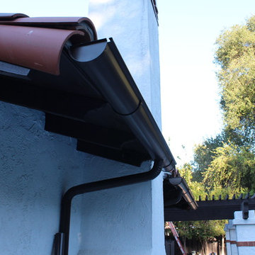 Half Round Rain Gutters with Wrap Around 10 Gauge Twisted Rafter Mount Brackets