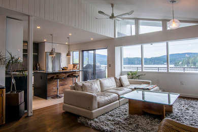 Living room - contemporary open concept living room idea in Vancouver with a standard fireplace, a brick fireplace and a tv stand