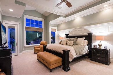 Example of a large transitional master carpeted and beige floor bedroom design in Salt Lake City with beige walls and no fireplace