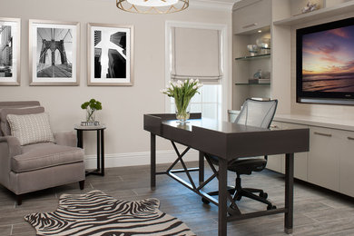 Study room - transitional freestanding desk dark wood floor study room idea in Miami with beige walls