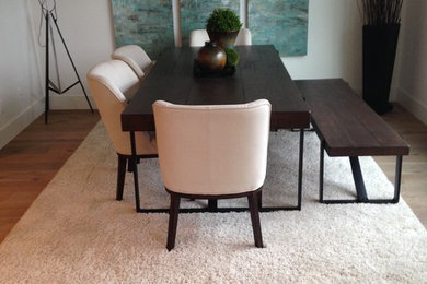 Example of a light wood floor dining room design in Calgary