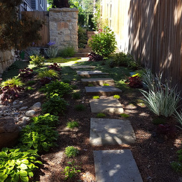 Landscape bed with boulders & pathway