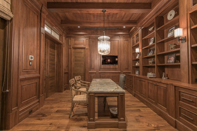 Inspiration for a large tropical freestanding desk light wood floor study room remodel in Tampa with brown walls