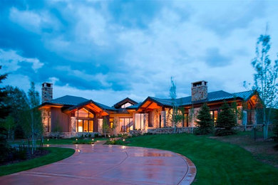 Large contemporary beige one-story mixed siding exterior home idea in Denver