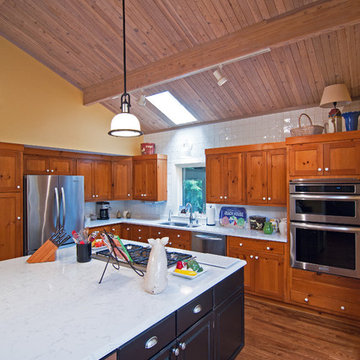 Lodge Look Makeover with Master Bedroom and Garage Addition in Wooded Setting