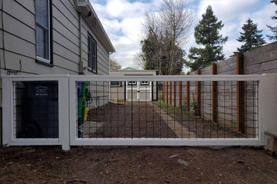 Design ideas for a transitional wood fence landscaping in Portland.