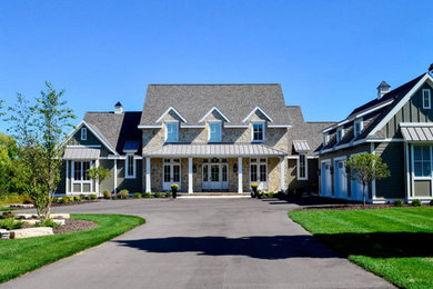 Inspiration for a cottage green two-story exterior home remodel in Other