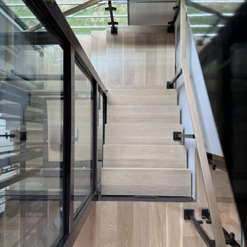 Project #136 | Modern Floating Staircase Encircling Glass Elevator
