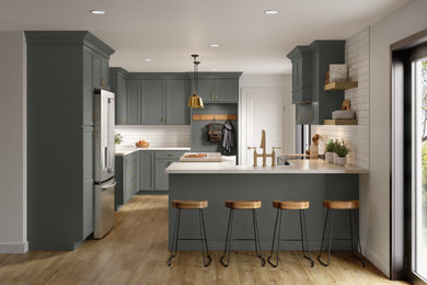 Eat-in kitchen - large transitional u-shaped medium tone wood floor and brown floor eat-in kitchen idea in Other with a farmhouse sink, flat-panel cabinets, gray cabinets, solid surface countertops, white backsplash, subway tile backsplash, stainless steel appliances, an island and white countertops