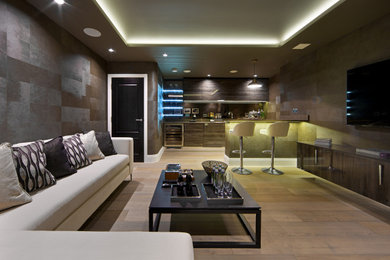 This is an example of a contemporary home bar in Hertfordshire.