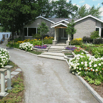 Stoney Lake, front entrance with pavers, garden and water feature