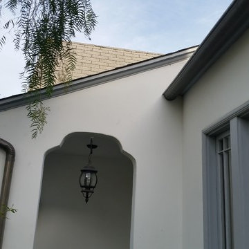 Bonderized Steel, 5 inch Half Round Seamless Gutters with Round Downspouts.