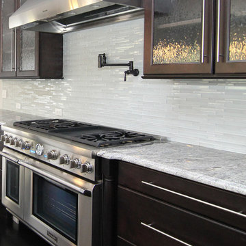White and black kitchen with pot filler