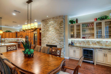 Inspiration for a large modern porcelain tile eat-in kitchen remodel in Phoenix with a double-bowl sink, shaker cabinets, light wood cabinets, granite countertops, multicolored backsplash, porcelain backsplash, stainless steel appliances and an island