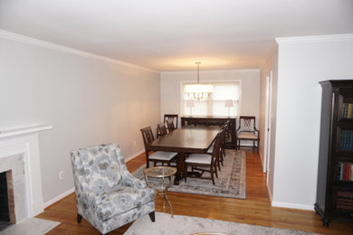 Great room - mid-sized traditional light wood floor great room idea in DC Metro with white walls, a standard fireplace and a tile fireplace