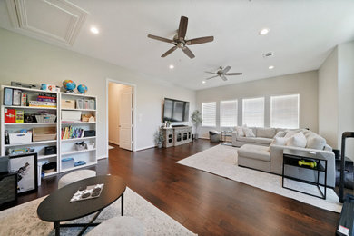 Example of a mid-sized trendy open concept dark wood floor living room design in Houston