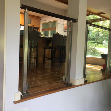 Modern railing system with tempered glass panels NJ