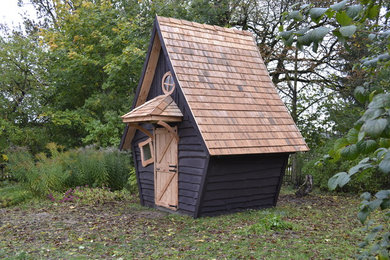 Inspiration for a small rustic detached shed remodel in Other