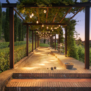 This is an example of a mediterranean backyard outdoor sport court in Florence with concrete pavers.
