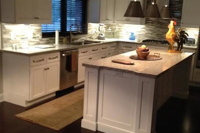 Inspiration for an eat-in kitchen remodel in Other with a single-bowl sink, recessed-panel cabinets, white cabinets, stainless steel appliances and an island