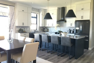 Mid-sized minimalist l-shaped vinyl floor and gray floor eat-in kitchen photo in Other with a single-bowl sink, shaker cabinets, white cabinets, granite countertops, gray backsplash, marble backsplash, stainless steel appliances, an island and gray countertops
