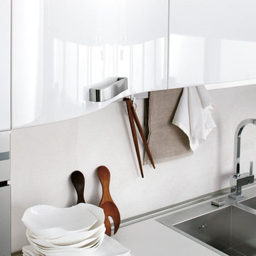 Modern white high gloss kitchen with curved cabinets