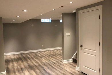 Minimalist basement photo in Toronto