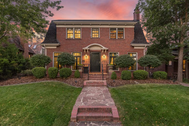 Inspiration for a timeless three-story brick house exterior remodel in Denver