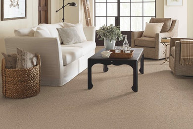 Example of a beach style living room design in Denver