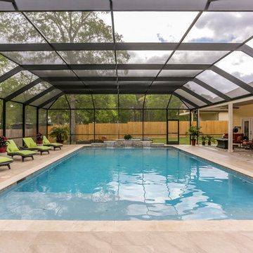 Patio with Fireplace with Screened Pool Enclosure