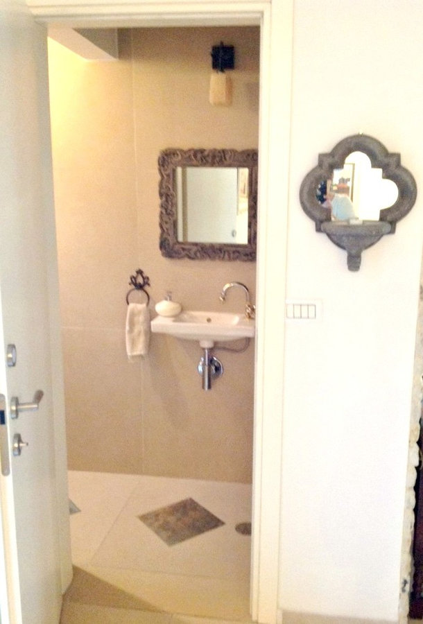 guest bathroom with slate floor inlay