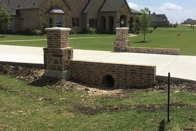 Design ideas for a huge traditional full sun front yard concrete paver driveway in Dallas.