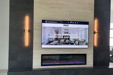 Inspiration for a large contemporary formal and open concept living room remodel in Miami with beige walls, a standard fireplace and a tile fireplace
