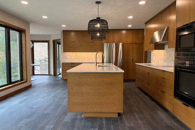 Inspiration for a large modern l-shaped dark wood floor and black floor eat-in kitchen remodel in Minneapolis with a single-bowl sink, flat-panel cabinets, medium tone wood cabinets, quartz countertops, beige backsplash, ceramic backsplash, stainless steel appliances, an island and beige countertops