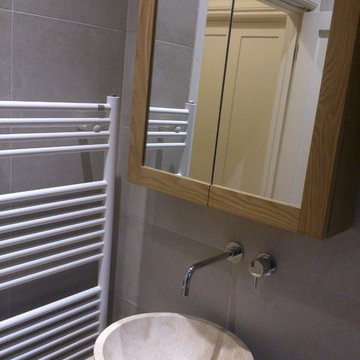 Options 106_ Wall-hung solid oak vanity unit and Travetine bowl