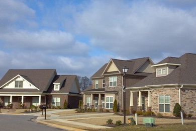 Example of a classic two-story brick exterior home design in Other